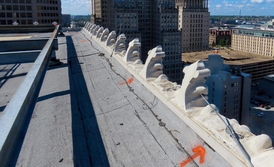Markings on church roof showing where repairs are needed